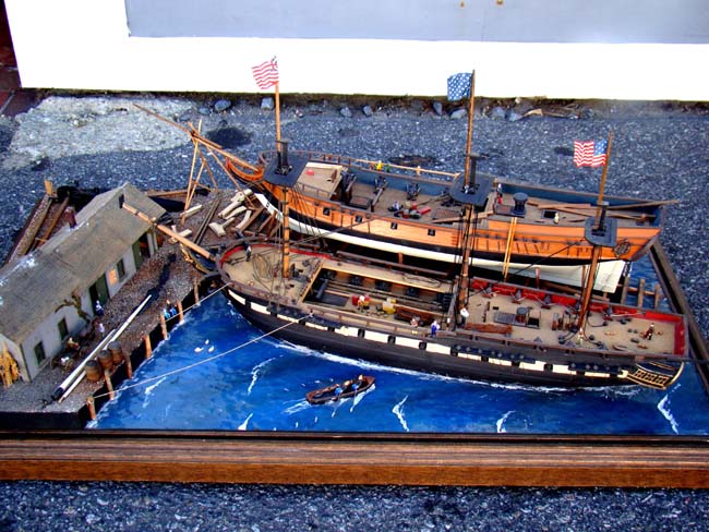 A fabulous and highly detailed scale model diorama circa 1920 of a New England Ship yard circa 1800-1812 making repairs on a 38 Gun American Frigate and a 10 Gun Privateer built circa 1785.